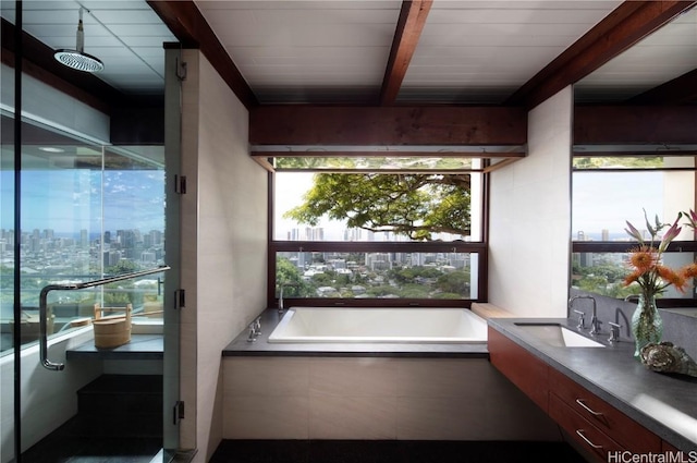 interior space featuring beam ceiling and sink