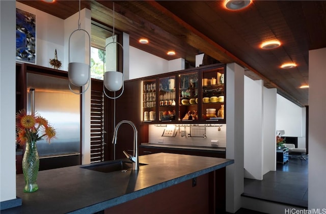 bar featuring wood ceiling and sink