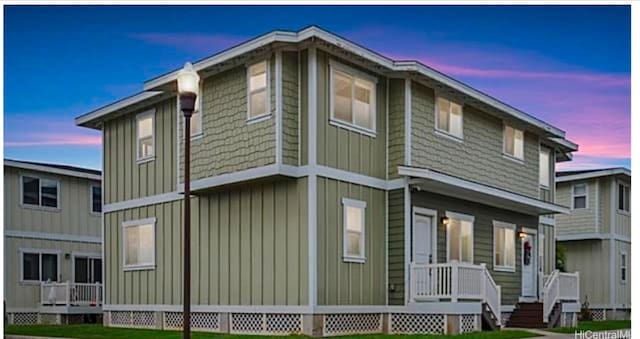 87-176 Maipalaoa Rd Unit J23, Waianae, HI 96792 - property exterior at dusk with a lawn