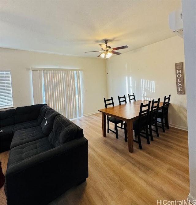 dining space featuring ceiling fan and light wood-type flooring