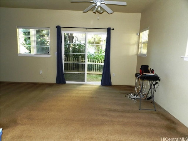 carpeted empty room with ceiling fan