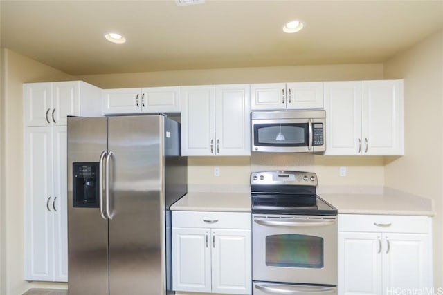 kitchen featuring white cabinetry and stainless steel appliances