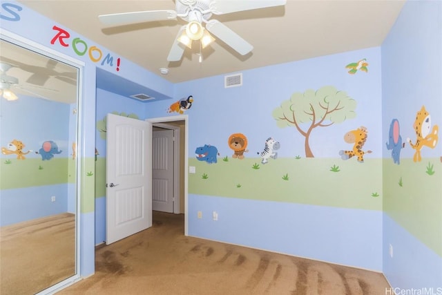 unfurnished bedroom with light carpet and ceiling fan