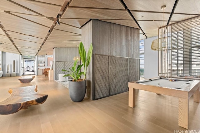 interior space with pool table and light hardwood / wood-style flooring