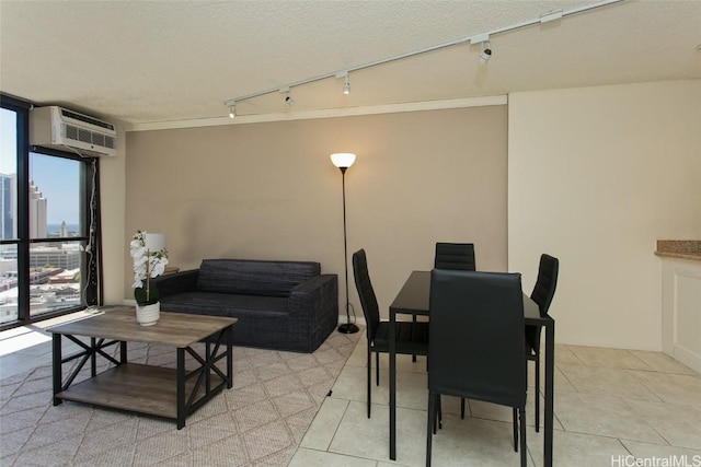60 N Beretania St Unit 2008, Honolulu, HI 96817 - dining space featuring a wall unit AC, expansive windows, light tile patterned floors, a textured ceiling, and track lighting