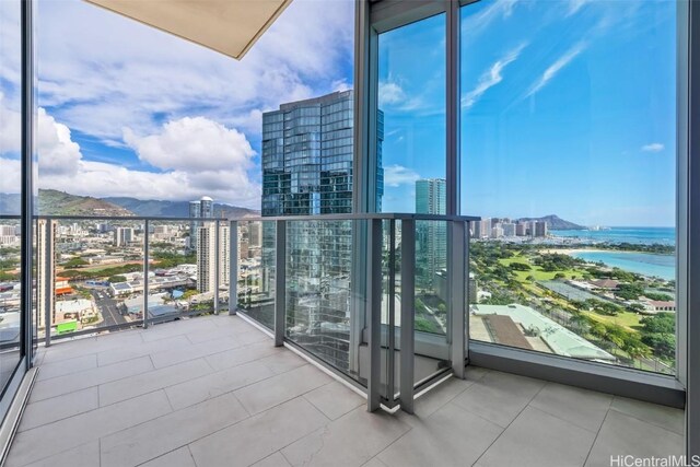 balcony featuring a water view