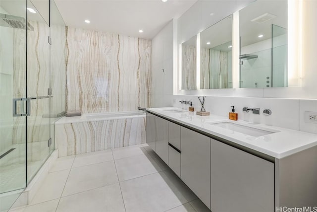 bathroom with tile patterned floors, vanity, and a shower with shower door