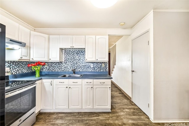 kitchen featuring tasteful backsplash, white cabinetry, sink, dark hardwood / wood-style flooring, and stainless steel electric range