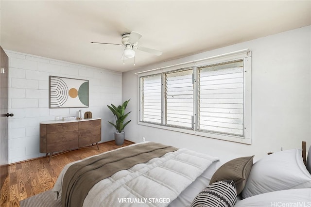 bedroom with ceiling fan and light wood-type flooring