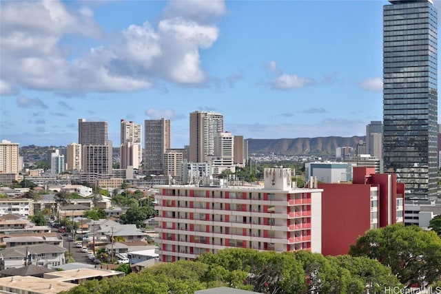 property's view of city with a mountain view