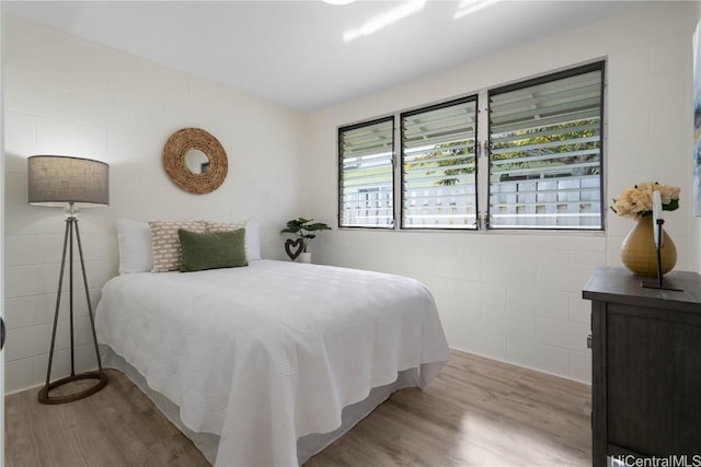 bedroom with light hardwood / wood-style floors