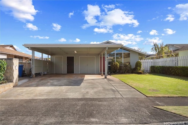 view of front facade featuring a front lawn and a carport