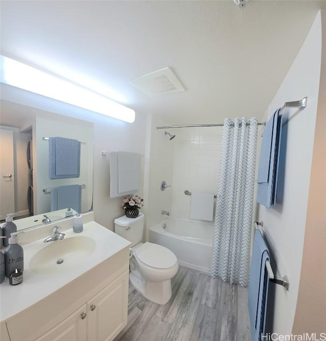 full bathroom with toilet, vanity, shower / bath combination with curtain, and hardwood / wood-style floors