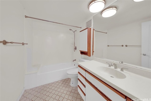 full bathroom featuring toilet, vanity, and  shower combination