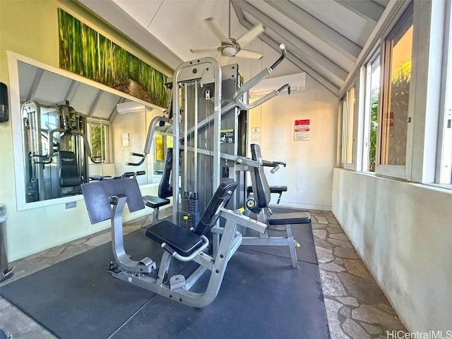 exercise room featuring lofted ceiling and ceiling fan