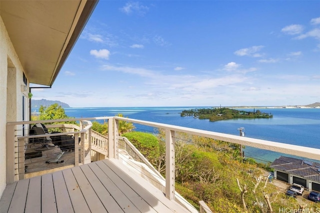 balcony featuring a water view