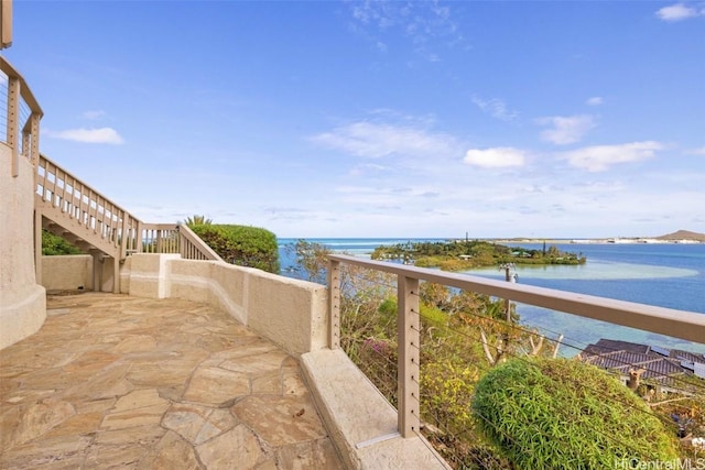 view of patio / terrace with a water view