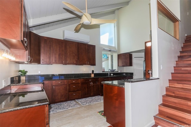 45-001 Lilipuna Rd Unit B, Kaneohe, HI 96744 - kitchen featuring a wall unit AC, a ceiling fan, beamed ceiling, high vaulted ceiling, and dark stone countertops