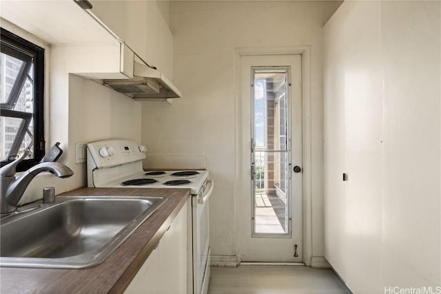 kitchen with sink, white range with electric stovetop, and plenty of natural light