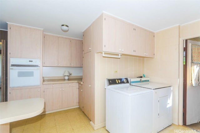 clothes washing area featuring washer / dryer