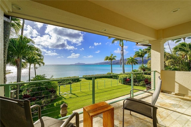 balcony featuring a water view