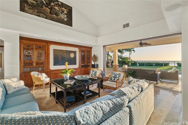 living room with ceiling fan, high vaulted ceiling, carpet flooring, and visible vents