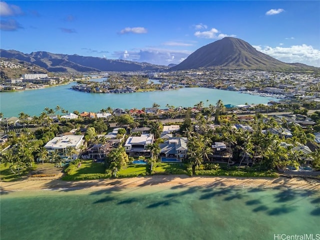 birds eye view of property featuring a water and mountain view