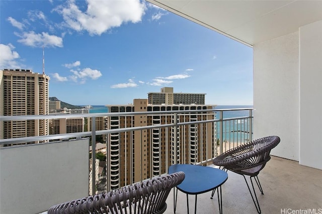 balcony featuring a water view