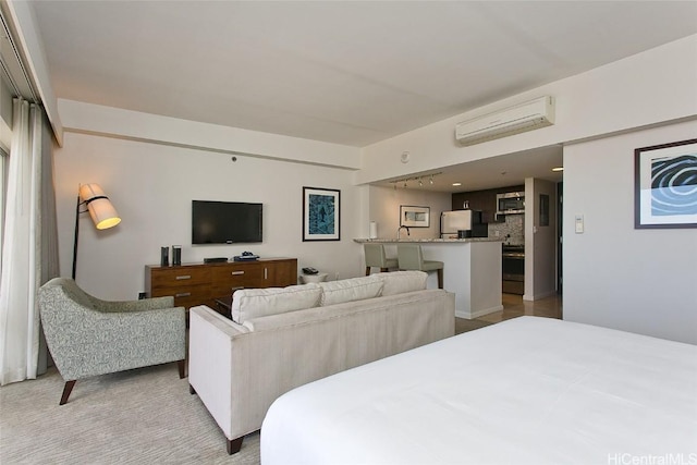 bedroom featuring a wall mounted air conditioner and fridge