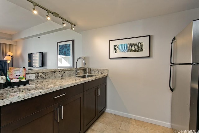 bathroom with sink and tile patterned flooring