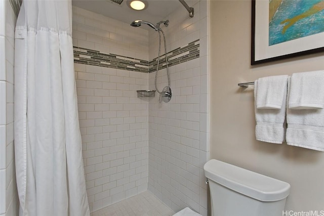 bathroom with toilet and walk in shower