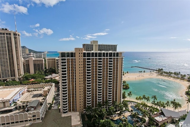 drone / aerial view featuring a water view and a view of the beach