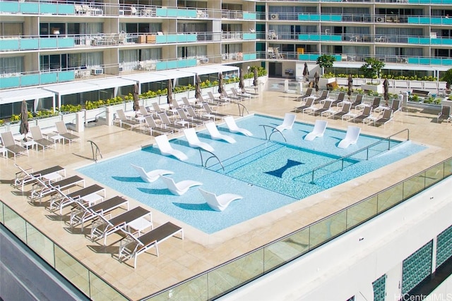 view of swimming pool with a patio