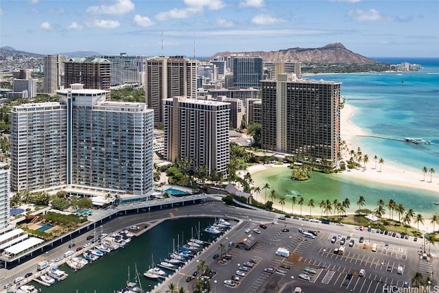 birds eye view of property featuring a beach view and a water and mountain view