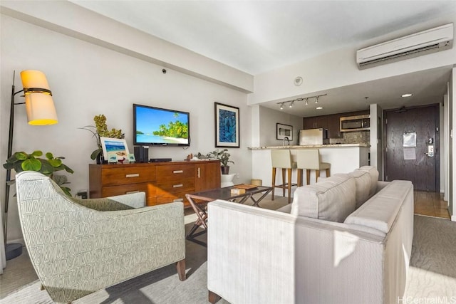 living room featuring a wall mounted air conditioner and track lighting