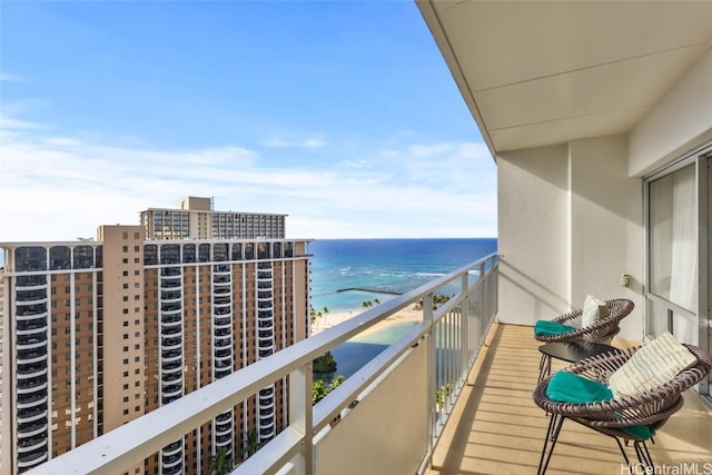 balcony with a view of the beach and a water view