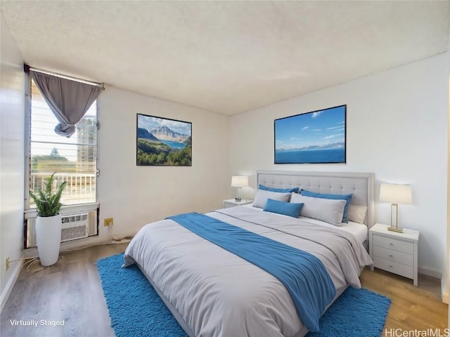 bedroom featuring wood-type flooring