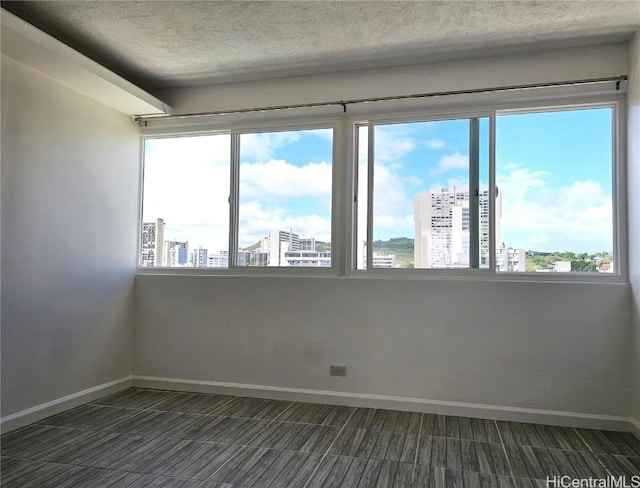 empty room featuring a textured ceiling