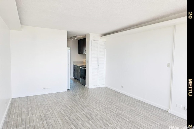 spare room featuring a textured ceiling