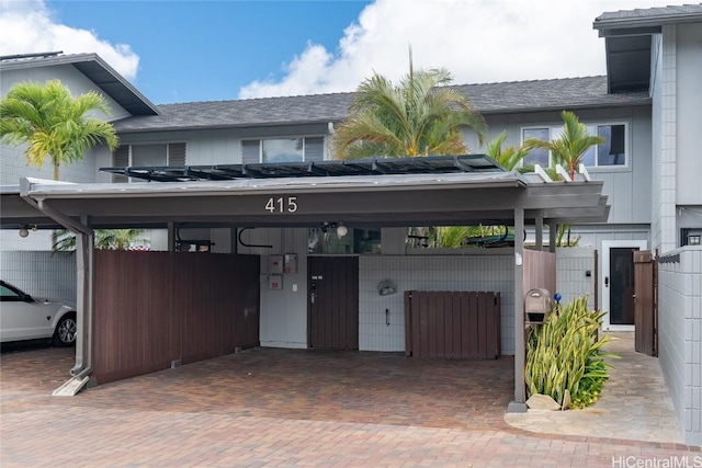 view of front of home featuring a carport