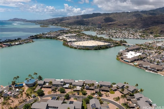 drone / aerial view featuring a water and mountain view