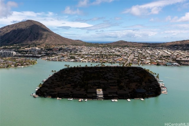 drone / aerial view with a water and mountain view