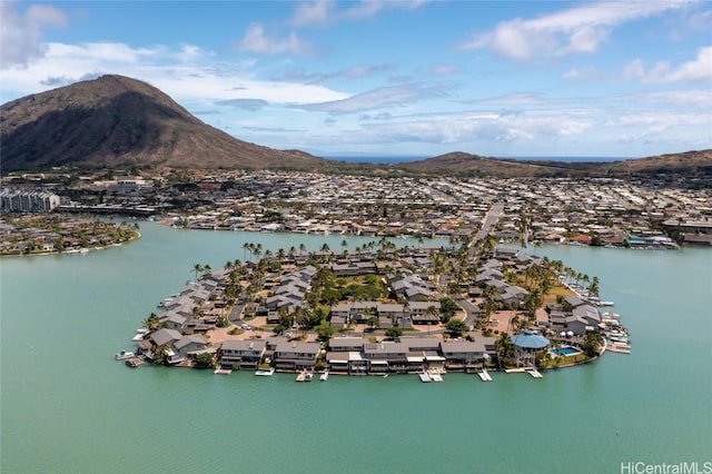 drone / aerial view with a water and mountain view