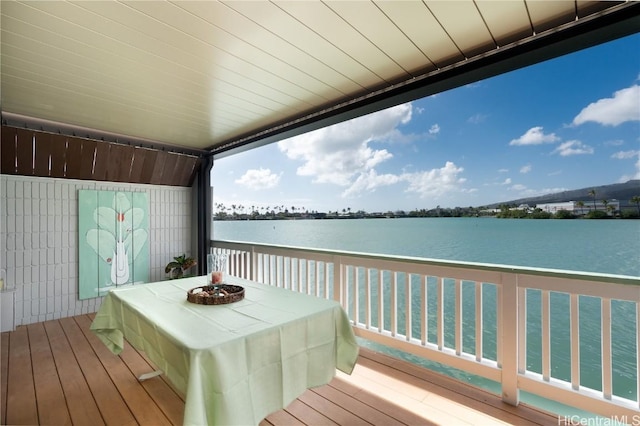 wooden terrace with a water view