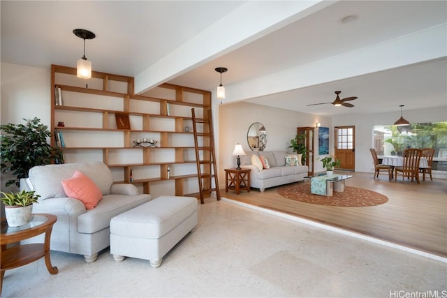 living room with ceiling fan and beamed ceiling