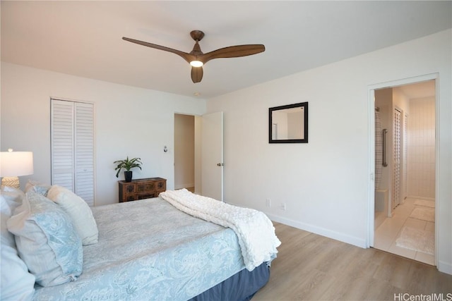 bedroom with ceiling fan, a closet, ensuite bath, and light wood-type flooring