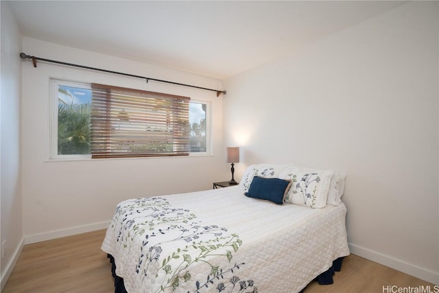 bedroom with light hardwood / wood-style flooring