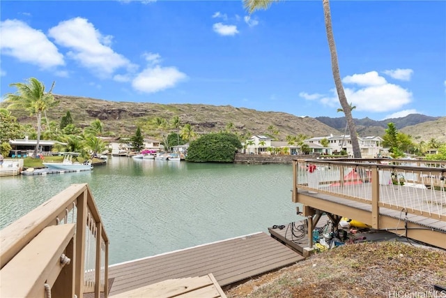 dock area with a water and mountain view