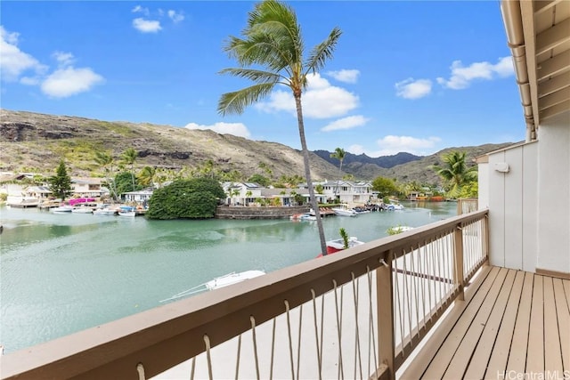 balcony with a water and mountain view