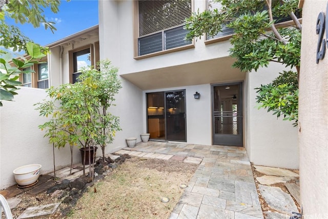 doorway to property featuring a patio area